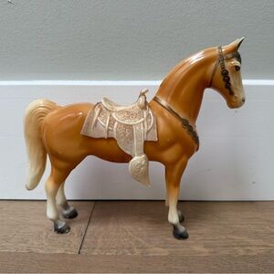 Vintage Breyer Western Glossy Palomino pony w/ saddle. No USA mark - early model
